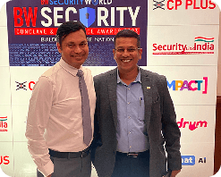 Capt Uday K. Shriwas posing with another professional at a security industry event