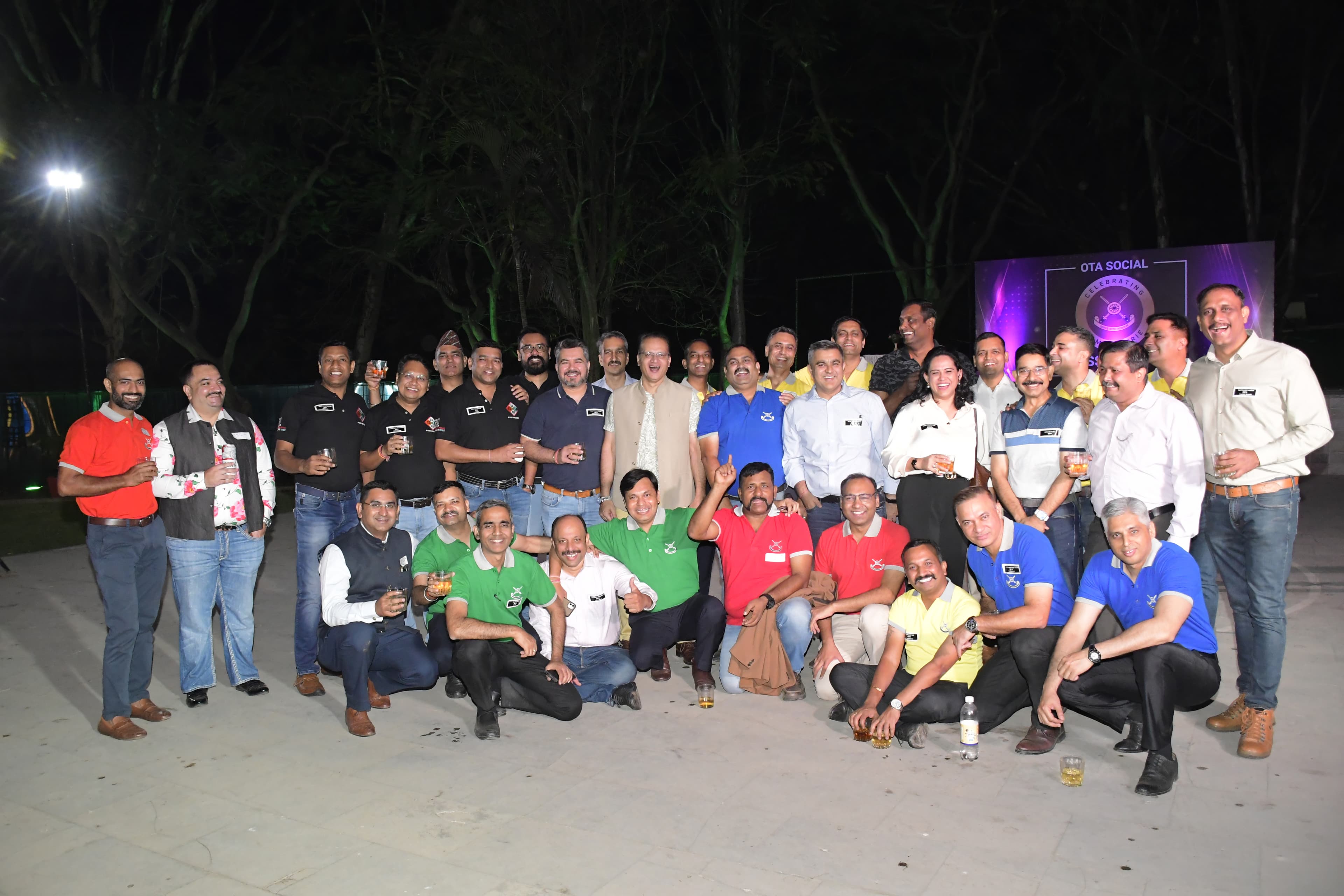 unnitee community members posing together at an outdoor evening event