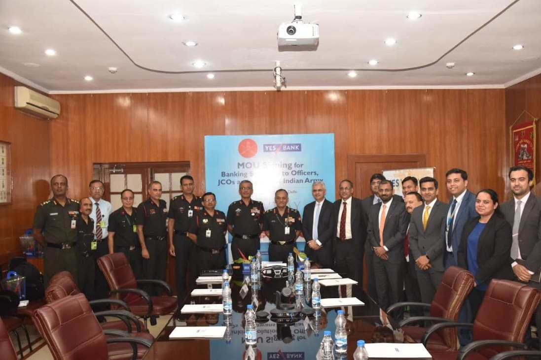 Indian Army officers and banking leaders gathered after an agreement signing