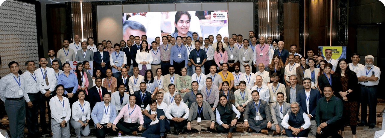 Professionals networking at an outdoor conclave venue