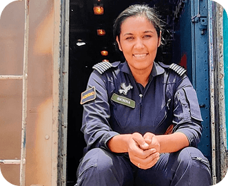 Rochena seated in uniform at a train doorway