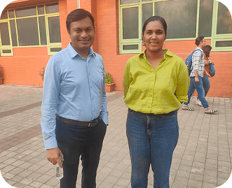 Rochena standing outdoors with Capt Uday