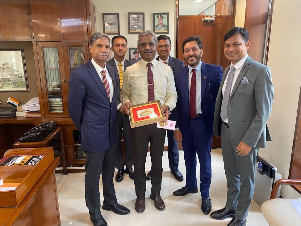 Arthveer and business leaders presenting a commemorative award